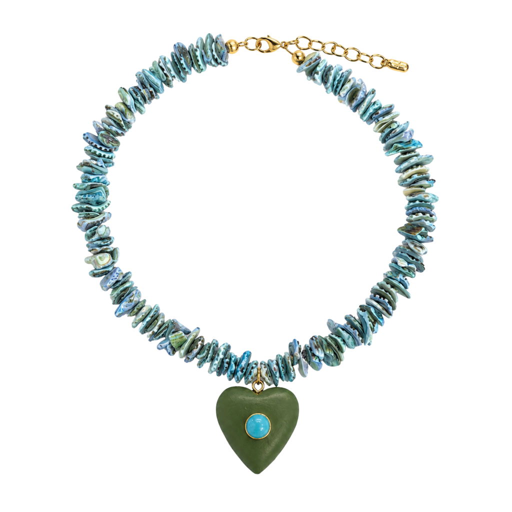 A chunky necklace made of irregular turquoise-blue and green shell-like beads with a dangling olive green heart charm featuring a small light blue stone, shown on a plain white background.